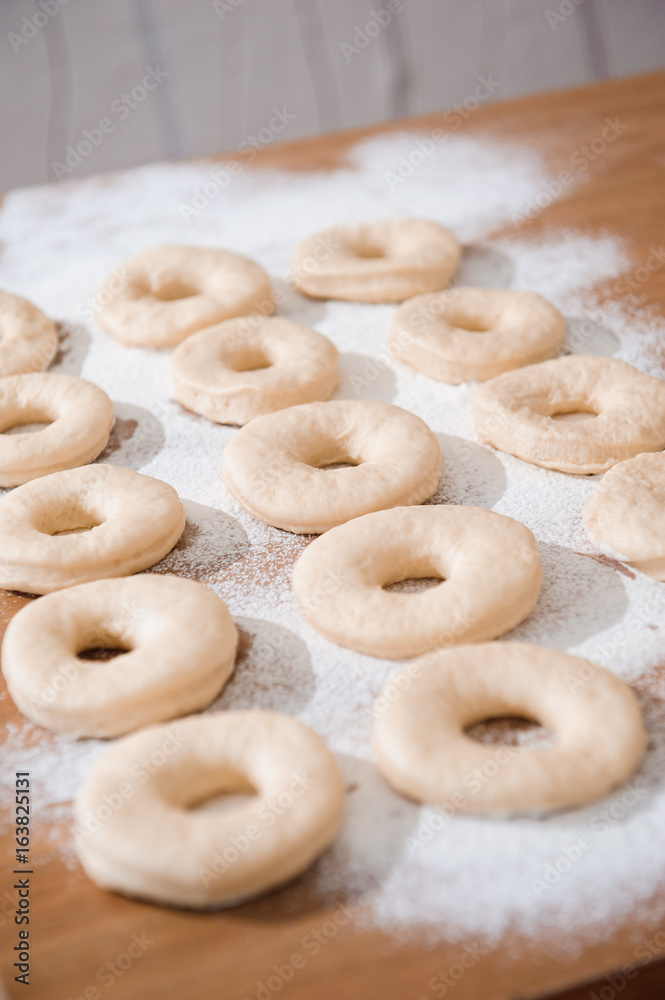 Chef preparing dough - cooking donuts process