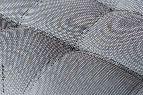 Fotografie Texture fabric gray sofa with firmware