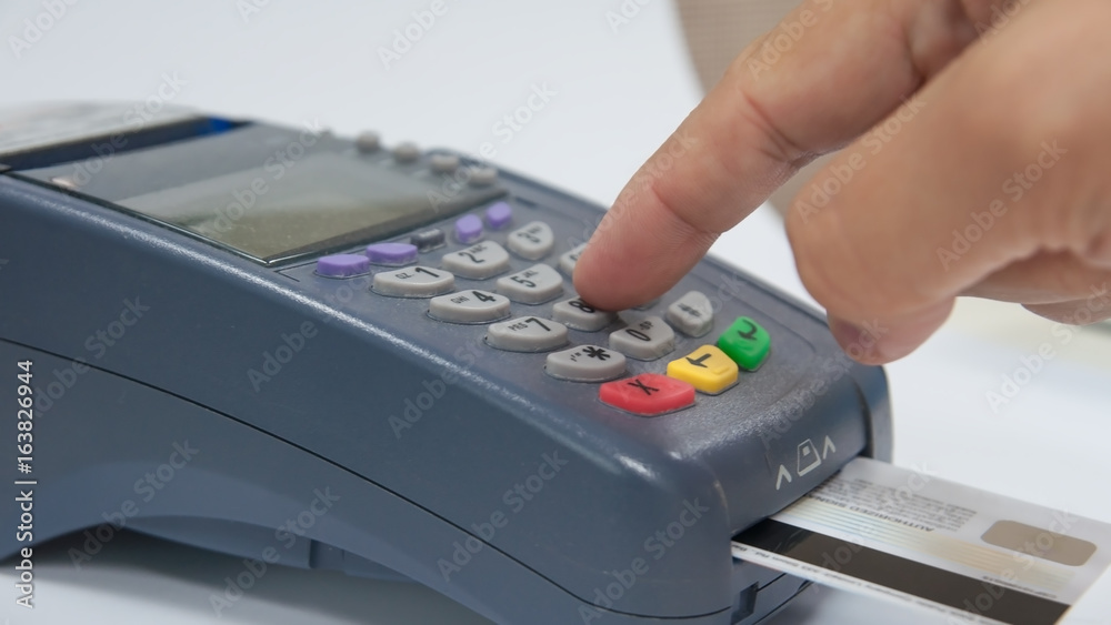 Unidentified people finger use EDC machine for credit card payment. Unidentified people finger use EDC machine for credit card payment.