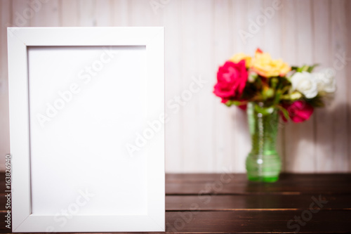 flowers with chalkboard on wooden table. copy space and celebration concept © eplisterra