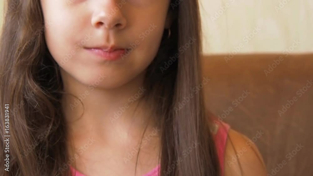 The girl eats raspberries. Little girl with raspberries. The girl eats raspberries. Little girl with raspberries.