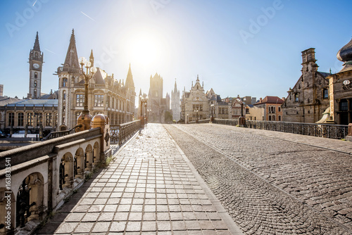 Beautiful view on the old town from saint Nicholas bridge during the sunrise in Gent city, Belgium