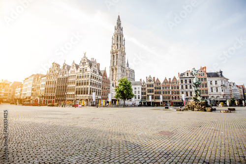 Morning view on the Grote Markt with beautiful buildings and church tower in Antwerpen city, Belgium photo