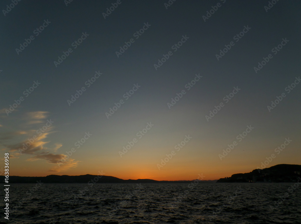 Deep Blue and Orange Norwegian Sunset Sky over the North Sea in Bergen, Norway 