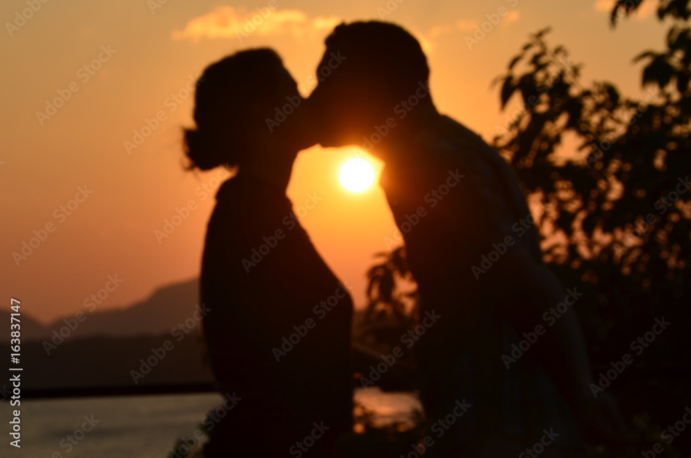 Honeymoon couple kissing at sunset in Sri Lanka