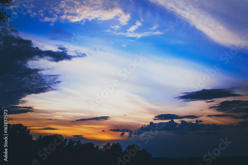 The majestic beautiful blue sky of sunset. Pre-threatening mood. Cloudy abstract background.