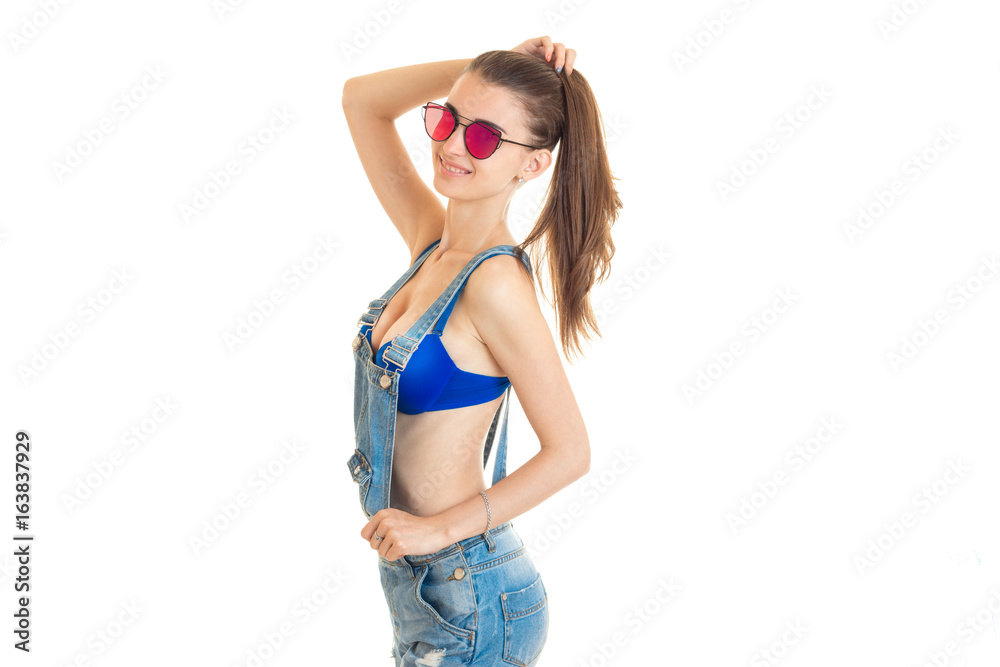 cheerful brunette with big silicon boobs in jeans overall Stock Photo |  Adobe Stock