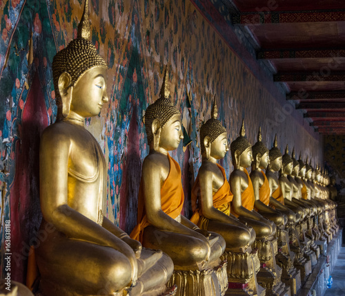 A row of seated Buddhas at the temple of Wat Arun in Bangkok  Thailand