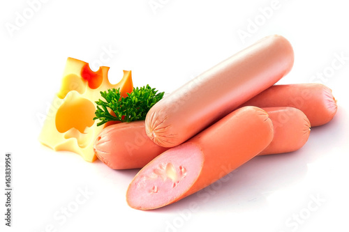 Four sausages with cheese and curved parsley Isolated on white Closeup