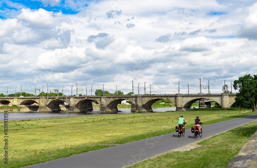 Elberadweg in Dresden mit Elbwiese und Marienbrücke photo