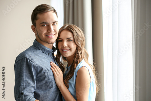 Beautiful young couple at home