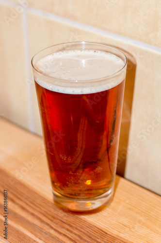 Glass of Amber Ale beer.