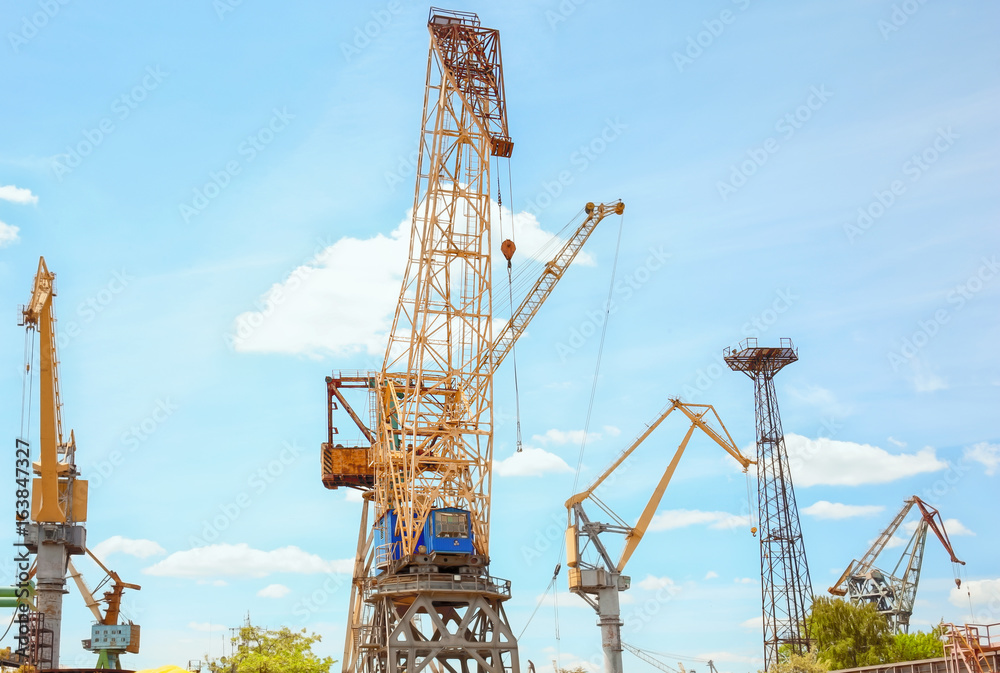 Hoisting cranes in shipyard