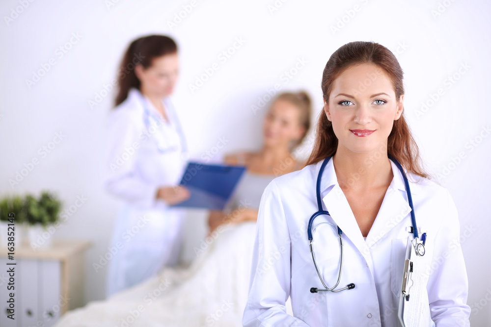 Woman doctor with folder standing at hospital Woman doctor with folder standing at hospital