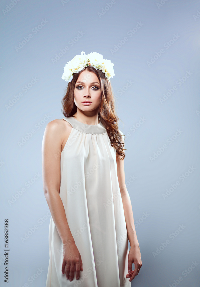 Portrait of a beautiful woman with flowers in her hair Portrait of a beautiful woman with flowers in her hair