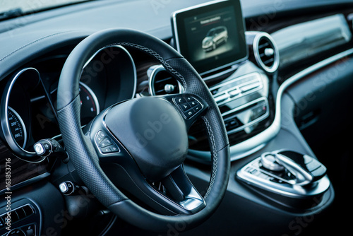 Auto. Luxury car steering wheel and dashboard © Room 76 Photography