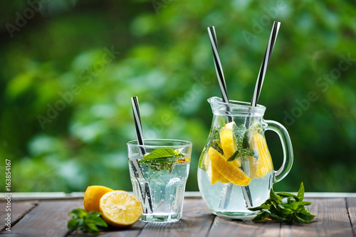 Vászonkép Tasty refreshing homemade lemonade on wooden table