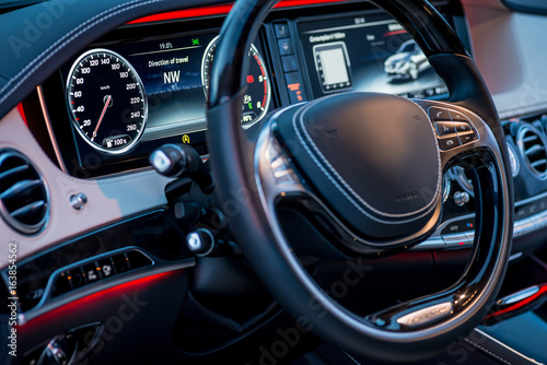 Auto. Luxury car steering wheel and dashboard © Room 76 Photography