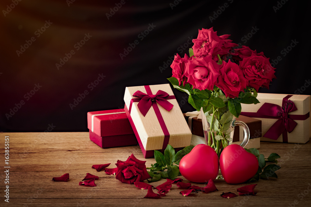 red roses flowers with red couple heart valentine festival gift on dark background red roses flowers with red couple heart valentine festival gift on dark background