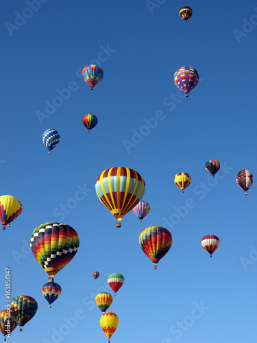 Colorful Hot Air Balloons Fly in a Clear Blue Sky