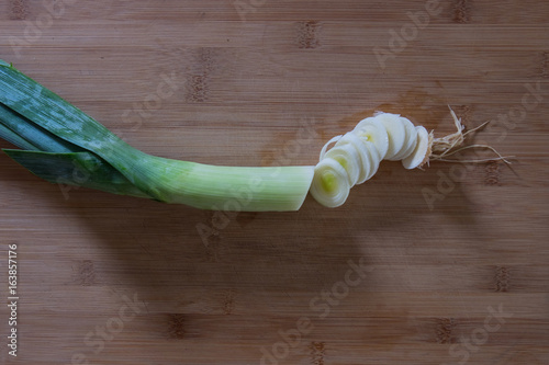 Partly Chopped Leek on Wooden Cutting Board