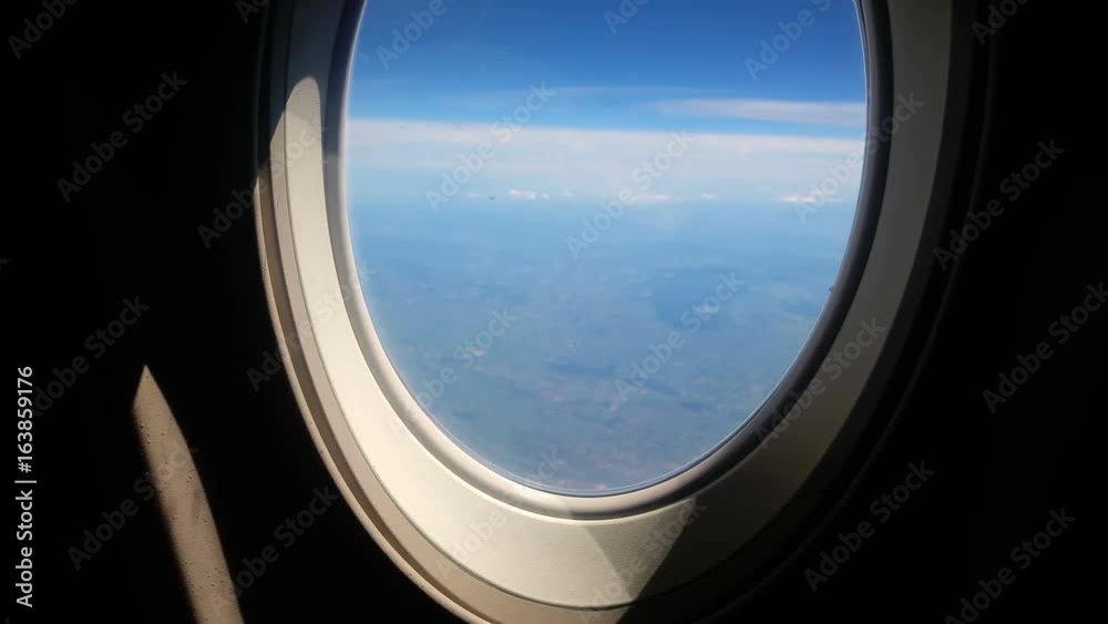 Airplane seat and window inside an aircraft