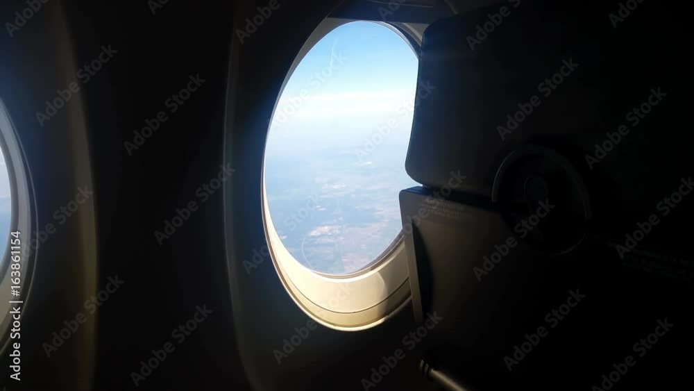 Airplane seat and window inside an aircraft Airplane seat and window inside an aircraft