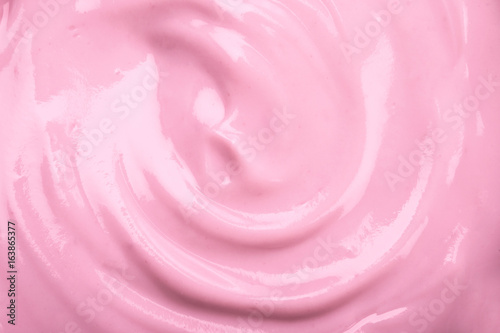 close up the pink creamy homemade blueberries or strawberries yogurt texture background