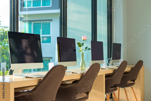 Wallpaper Mural computer desktop with keyboard, diary and other accessories on table in cafe Torontodigital.ca
