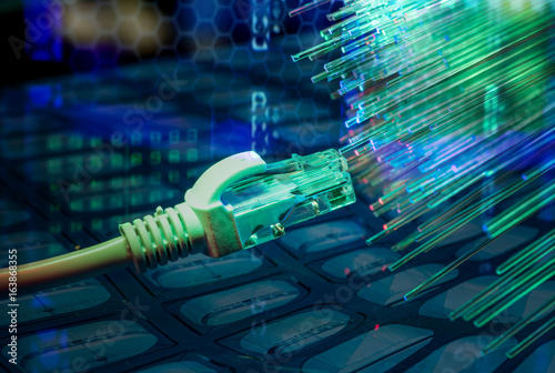 network cables closeup with fiber optical background photo