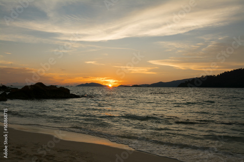 Sunset on the beach at Li pe island in Thailand, gold sea sunset, Cyprus sunset.