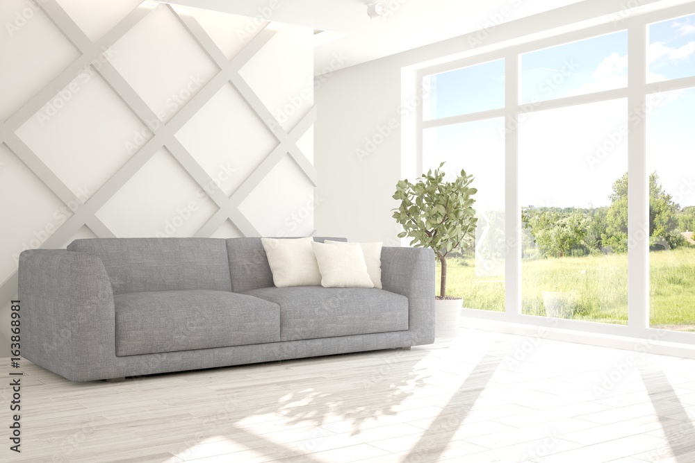 Fototapeta premium White room with sofa and green landscape in window. Scandinavian interior design. 3D illustration