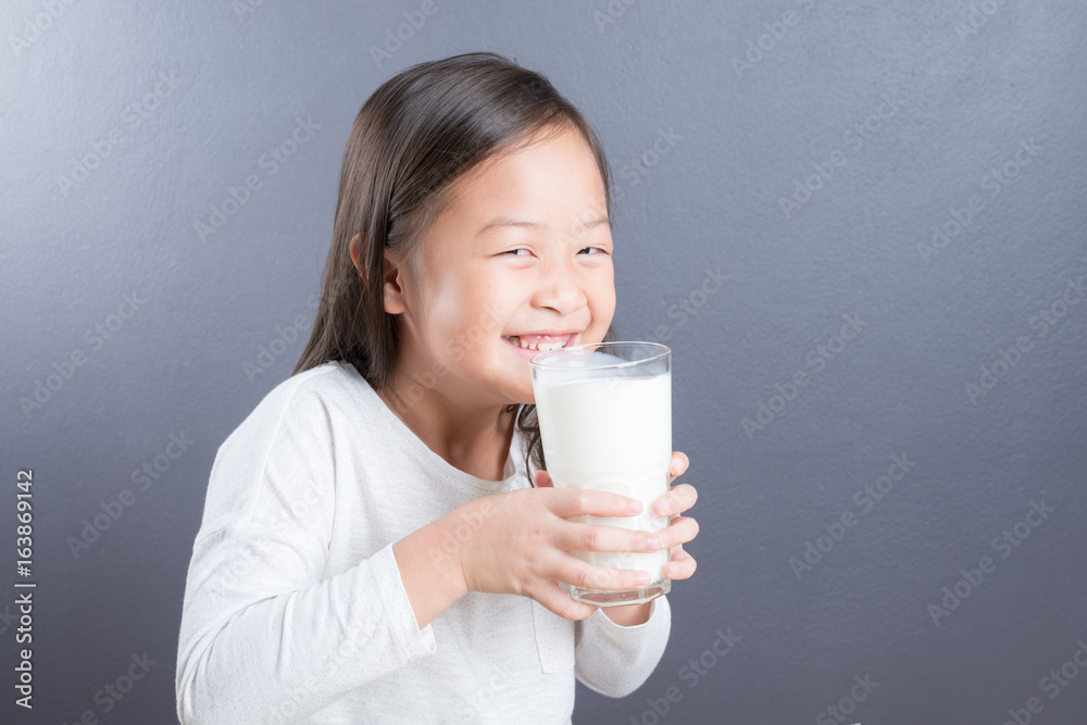 Asian kid cute girl happy to drink milk Asian kid cute girl happy to drink milk