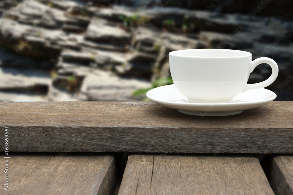 White coffee cup on wood floor. White coffee cup on wood floor.