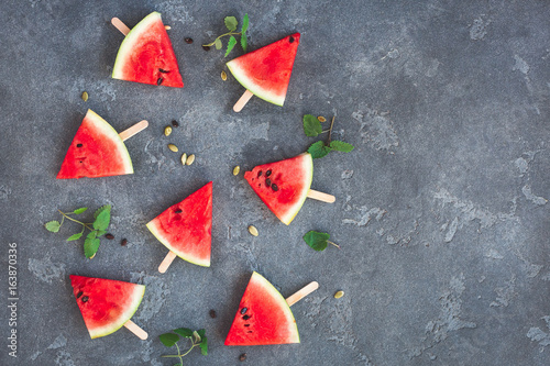 Watermelon pattern. Sliced watermelon on dark background. Flat lay, top view, copy space