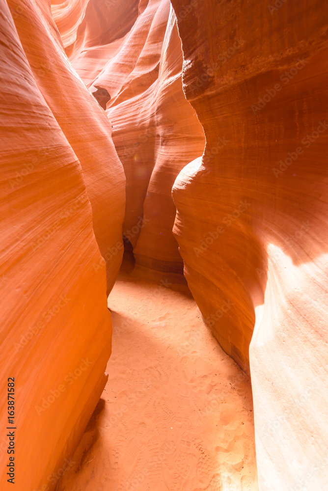 Path through lower Antelope Canyon - located on Navajo land near Page, Arizona, USA - beautiful colored rock formation in slot canyon in the American Southwest