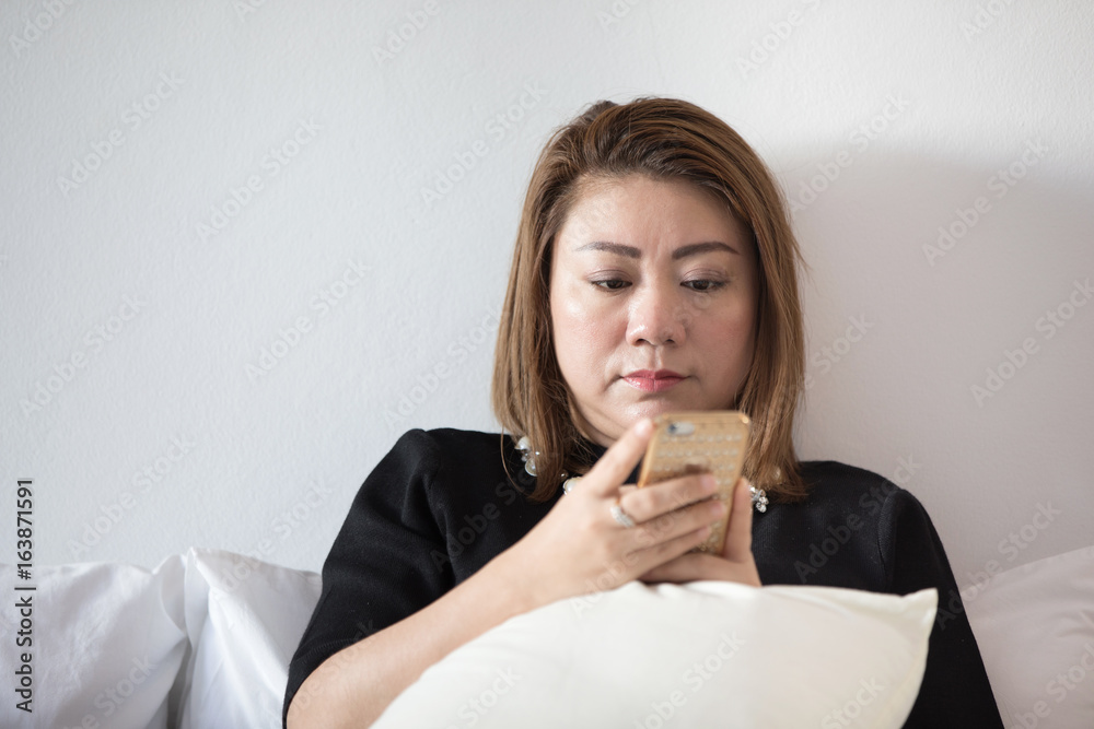 Asian woman utilization cell phone portrait. Asian woman utilization cell phone portrait.