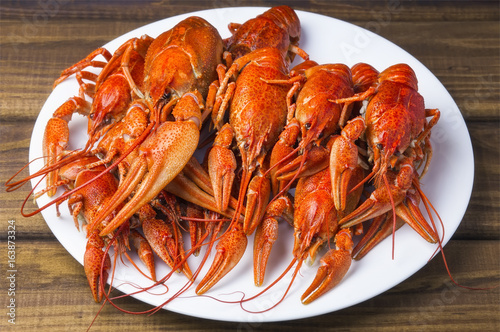 Tasty boiled crayfishes on a white plate