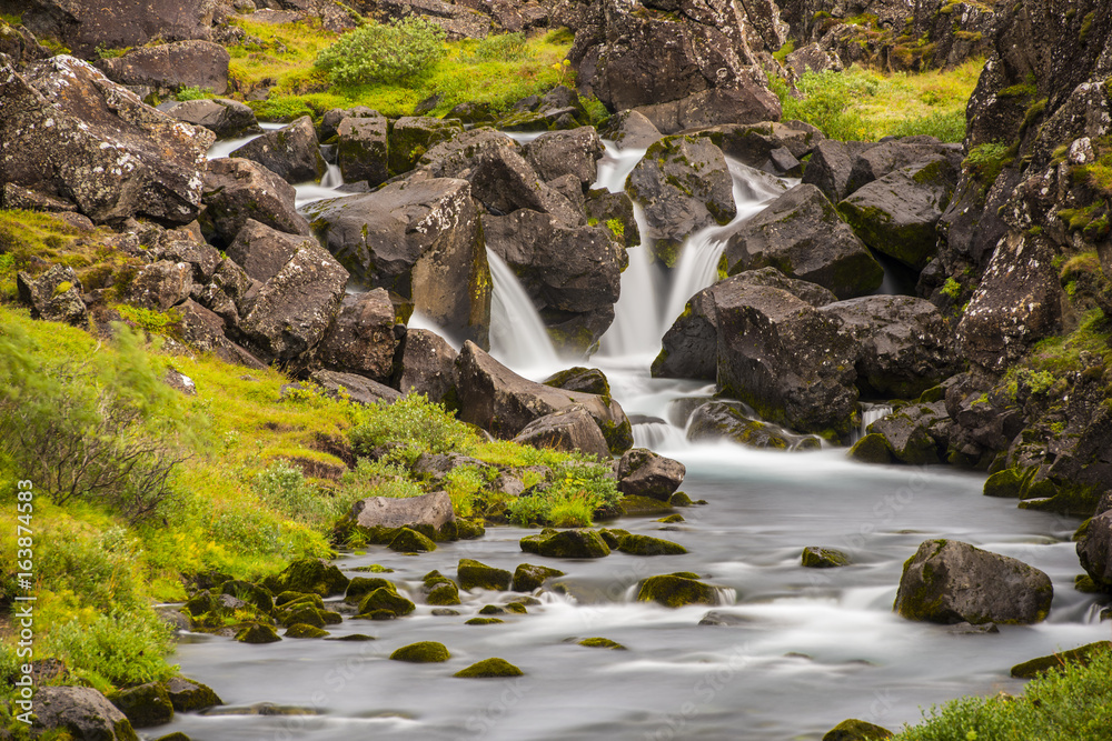 Waterfall Long Exposure iwth grass and rocks Waterfall Long Exposure iwth grass and rocks
