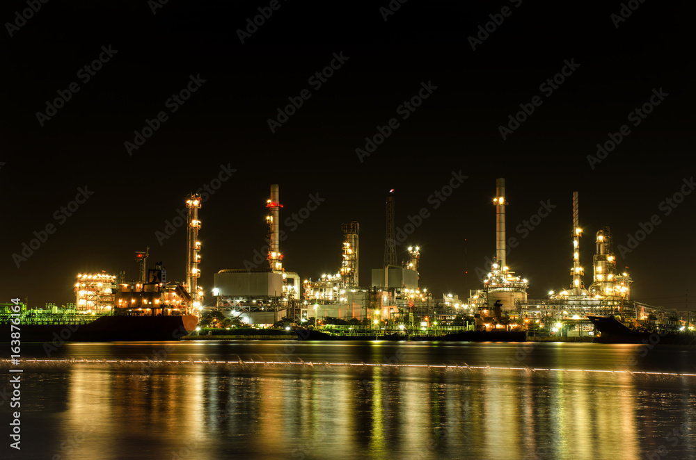 oil refinery with water reflections, petrochemical plant oil refinery with water reflections, petrochemical plant