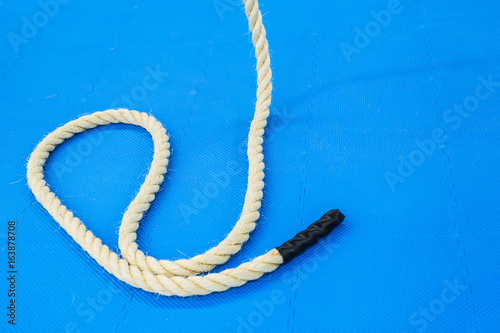 Close up of a battle rope on a gym. Sport and fitness equipment.