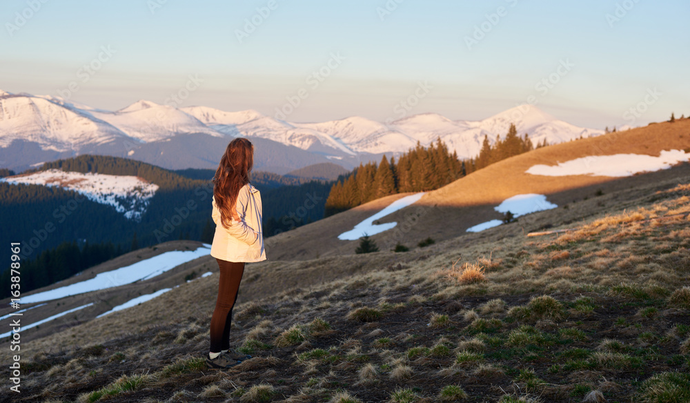 Shot of a woman admiring the view of mountains while hiking copyspace travel travelling tourism active sport nature calamity harmony idyllic landscape