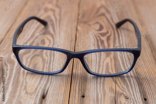 glasses on wooden background