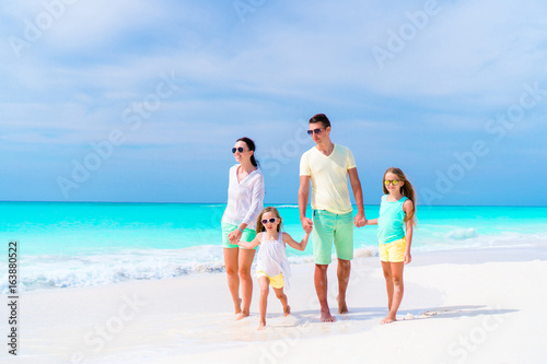 Photography Young family on vacation on the beach. Family travel concept