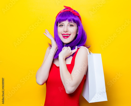 girl with purple color hair and shopping bag