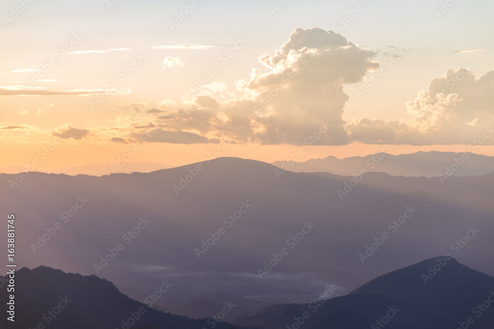 Obraz premium Sunset scene with silhouette mountain at Doi Luang Chiang Dao, Chiang Mai Province, Thailand