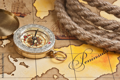 compass and rope on map