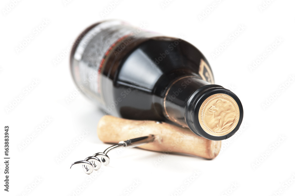 bottle of wine and a corkscrew isolated