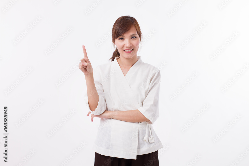 woman spa therapist pointing up 1 finger, counting, numbering woman spa therapist pointing up 1 finger, counting, numbering