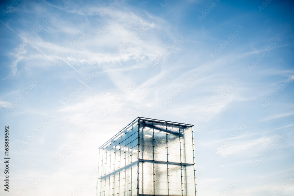 Modern transparent architectural structure on the blue sky background with copy space Modern transparent architectural structure on the blue sky background with copy space